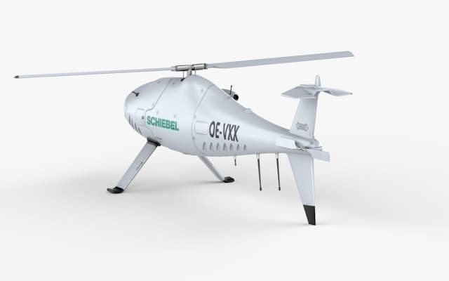 A white unmanned cargo helicopter drone on landing skids
